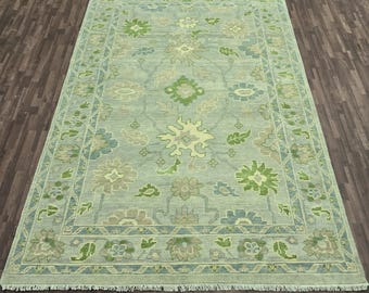 Hand-Knotted Wool Rug: Delicate Floral Design, Weathered Finish