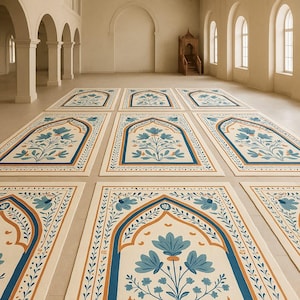 May include: An array of prayer rugs with a cream-colored background and a floral design in shades of blue and orange. The rugs are arranged in a large, open space with arched doorways and windows.