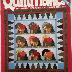 Puede incluir: Una portada de revista para Quiltmaker, una revista de patrones para acolchadores. La portada presenta un diseño de acolchado con una escena invernal de casas y árboles. La revista es el número 28, principios de otoño de 1992. El texto de la portada dice "¡19 grandes patrones!" y "La revista de patrones para los acolchadores de hoy."
