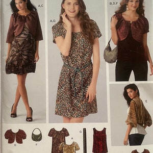May include: A sewing pattern for a dress and a bolero jacket. The pattern is from Simplicity and is easy to sew. The pattern includes a variety of styles, including a dress with a belt, a bolero jacket with a shawl collar, and a dress with a scoop neck. The pattern is for sizes 6-14.
