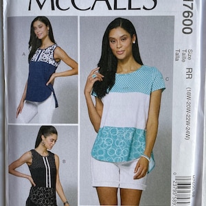 May include: A McCall's sewing pattern envelope featuring three different top designs. The envelope includes the text "McCall's", "M7600", and "NANCY ZIEMAN". The tops have various patterns and colors, including navy, white, and black.