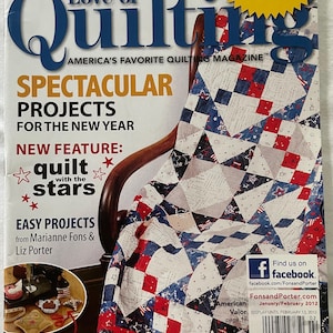 May include: A magazine cover for "Love of Quilting" featuring a quilt with red, white, and blue star and square patterns. The cover includes text such as "Spectacular Projects for the New Year" and "Easy Projects".