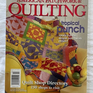 May include: A magazine cover for American Patchwork & Quilting, featuring a colorful patchwork quilt with a tropical punch theme. The cover text reads "tropical punch" and "rotary cut this simple patchwork project".
