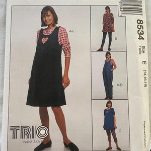 May include: A sewing pattern for a trio of dresses. The pattern is for sizes 14, 16, and 18. The pattern includes a dress with a heart-shaped cutout, a denim overall dress, and a tunic dress with leggings.