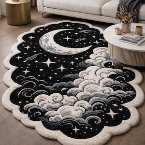 May include: An oval-shaped area rug with a scalloped edge featuring a black night sky background, a large white crescent moon, scattered white stars, and layered white and gray clouds along the bottom portion of the design.