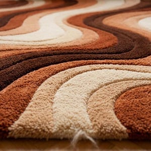 A close-up, low-angle view of the rug, showing the texture and wavy stripes in shades of brown, orange, and cream.