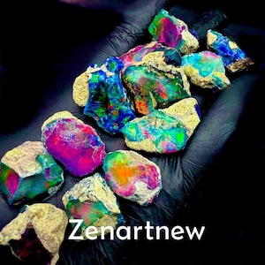 May include: A collection of vibrant, raw opals with a spectrum of colors including pink, blue, green, and orange. The opals are set against a black background, with the text "Zenartnew" in white.