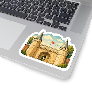 May include: A sticker depicting a watercolour illustration of a historic building with two towers and an arched entrance. A Turkish flag flies above. The sticker is on a laptop. The building is in a cartoon style.