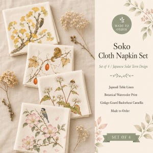 May include: A set of four square cloth napkins featuring botanical watercolour prints of ginkgo leaves with a bird, a gourd with a small animal, white flowers with a bee, and pink blossoms with a bird. The text reads Soko Cloth Napkin Set.