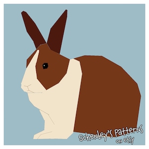 An illustration of this quilt pattern.  A rabbit is seen from the side.  It has dutch coloring, brown fur with a white band across its chest and a white stripe on its head.