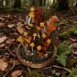 May include: A decorative mushroom arrangement in a wooden bowl. The arrangement features numerous yellow mushrooms with white stems, surrounded by orange and brown foliage, moss, and crystals. The bowl is set against a forest backdrop.