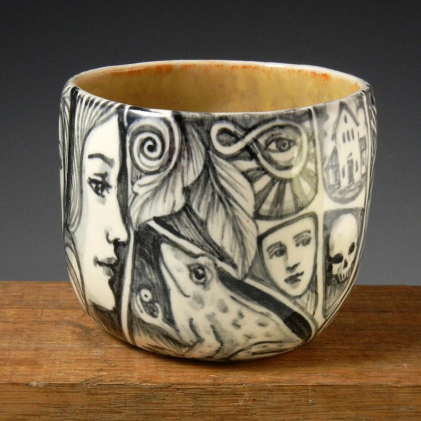 Black and white story cup tea bowl with frog, faces, Imagine, bird and more