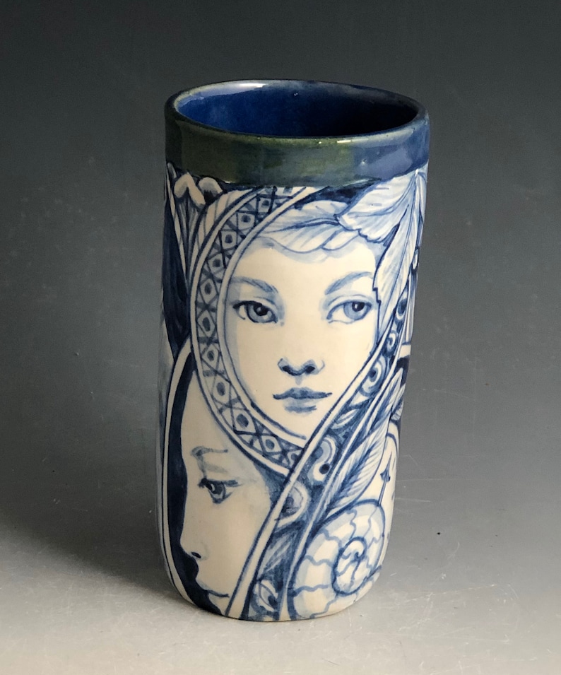 cat and more Blue and white vase with faces
