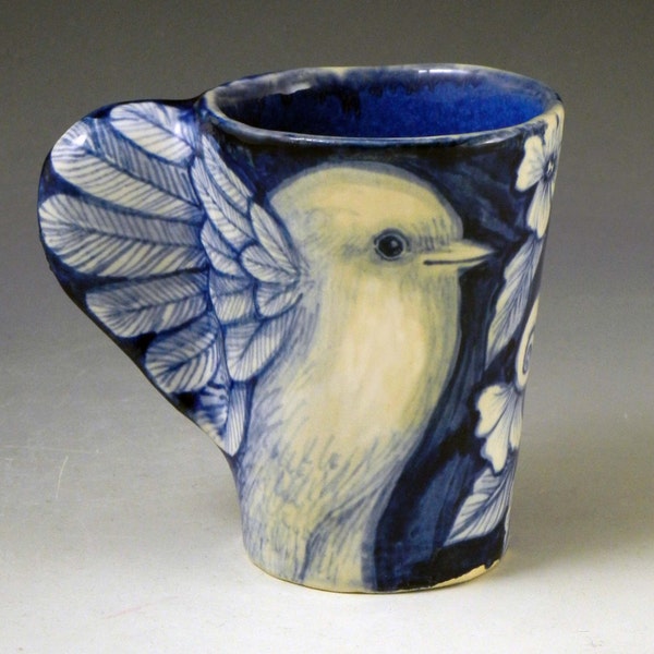 Blue and white porcelain bird cup with wings and flowers