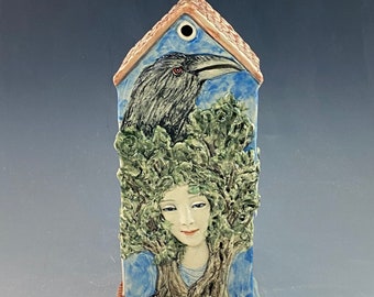 Lady with raven house one of a kind ceramic house sculpture with trees. Hand built and hand painted i9.2” tall