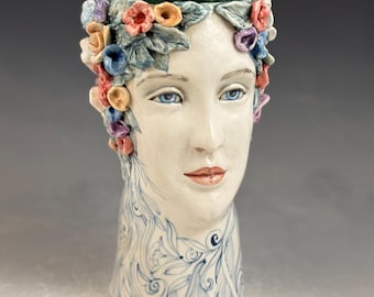 Face vase with many flowers, one of a kind