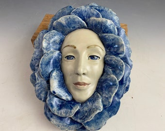 Sale! Wallflower ceramic sculpture in blue one of a kind sculpture of a lady with blue petals all around. Made for the wall 9” tall