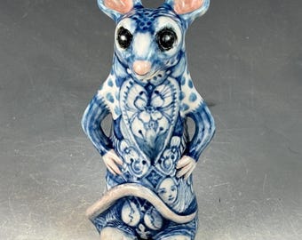 Lucky little white mouse with four leaf clover and more