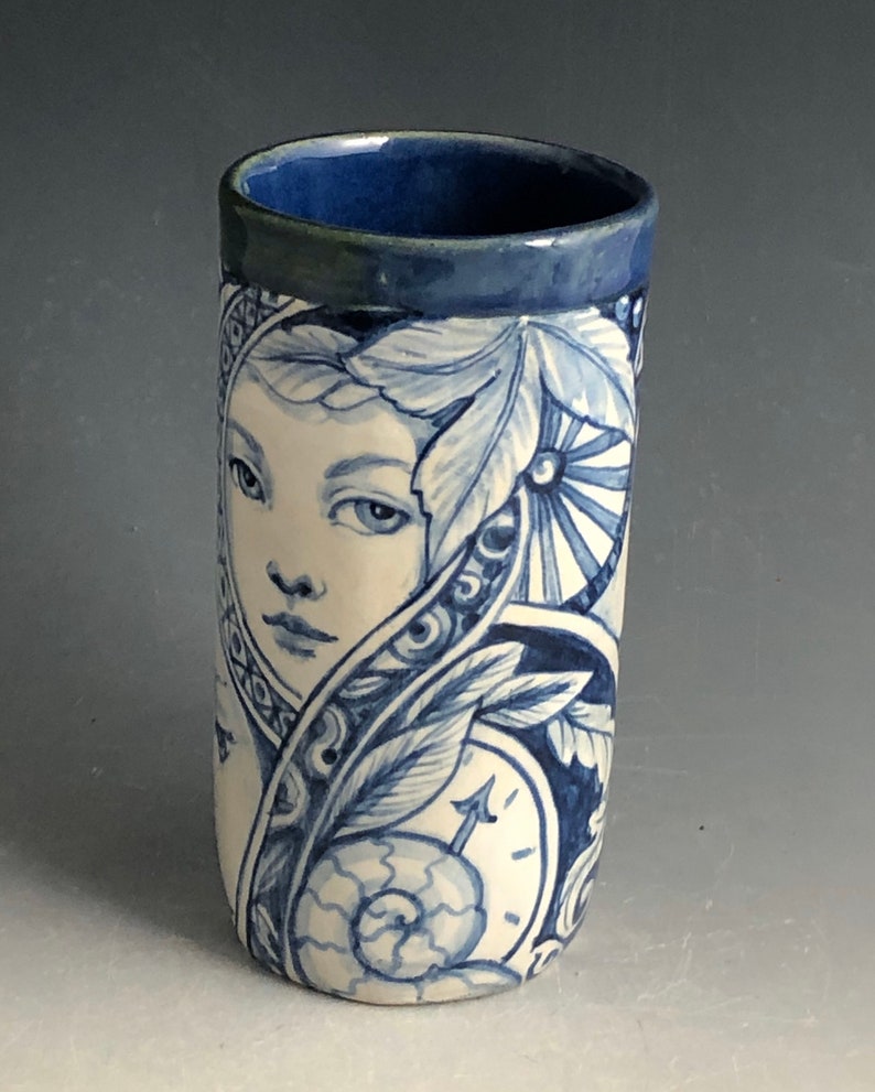 cat and more Blue and white vase with faces