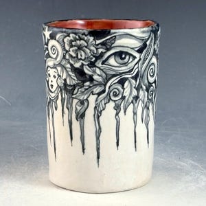 Handleless cup in black and white with rust interior 3.8 inches tall, OOAK