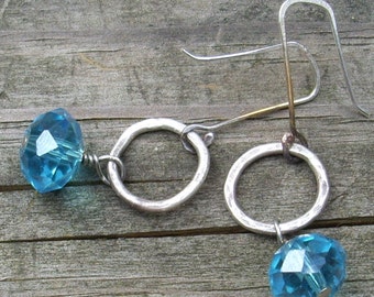 Blue Rondelles  on sterling silver hammered rings.