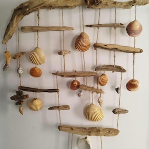 Natural, seaside wall hanging made of driftwood and shells, unique handmade decoration.