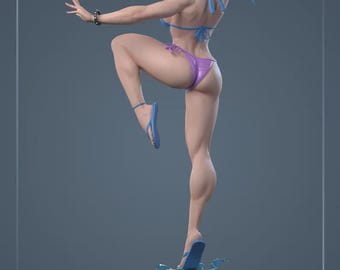 May include: A figurine of a woman in a fighting stance, wearing a blue bikini top and purple bikini bottoms. She is also wearing blue sandals and bracelets. The figurine is on a black base with blue water effects.