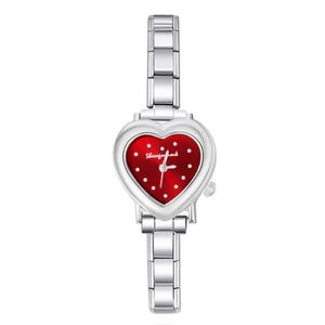 May include: A silver-toned wristwatch with a heart-shaped face. The watch face is red with white dots and the text "Shangfujia". The watch band is made of silver links.