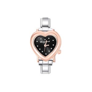 May include: A heart-shaped wristwatch with a black face and silver and rose gold accents. The watch face has small white dots and the brand name "Shenfongmb" in cursive. The watch has a silver band.