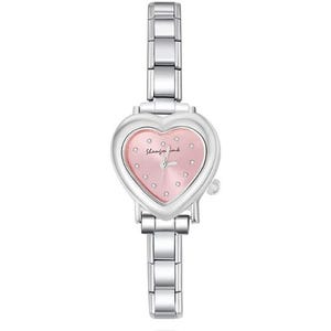May include: A silver-toned wristwatch with a heart-shaped face and a pink dial. The watch features a linked metal band and small, sparkling accents on the face. The text "Shanzin imb" is visible on the watch face.