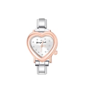May include: A heart-shaped wristwatch with a silver and rose gold finish. The watch face is white with small diamond accents and the text "Shanzin wink". The watch has a silver band.