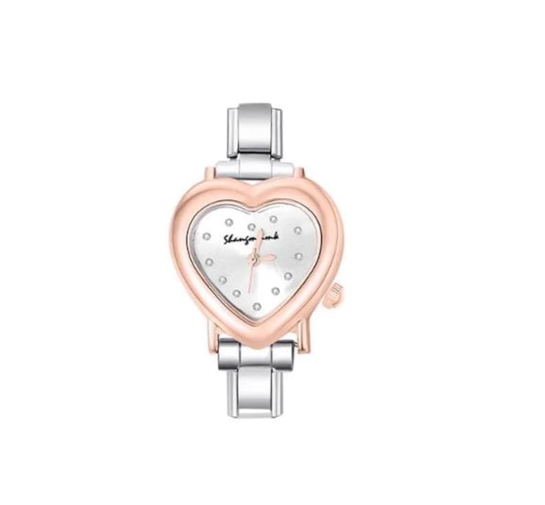 May include: A heart-shaped wristwatch with a silver and rose gold finish. The watch face is white with small diamond accents and the text "Shanzin wink". The watch has a silver band.