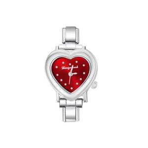 May include: A silver-toned wristwatch with a heart-shaped face. The watch face is red with white dots and the brand name. The watch has a silver band and a small crown on the side.