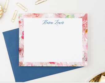May include: Pink floral stationery with a navy blue border and the name "Karen Lewis" printed in navy blue ink.