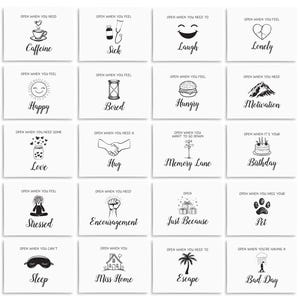 May include: A set of 16 small cards with black and white illustrations and text. Each card has a different message and image, such as "Open when you need caffeine", "Open when you feel sick", "Open when you need to laugh", and "Open when you feel lonely".