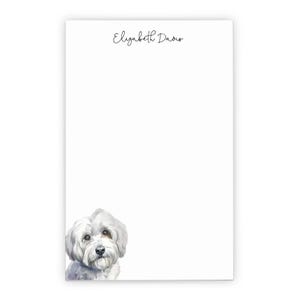 May include: A white rectangular notepad featuring the printed name Elizabeth Davis in a black script font at the top center and a detailed watercolor illustration of a small white fluffy dog positioned in the bottom left corner.