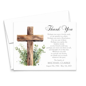May include: A white thank you card with a watercolor illustration of a wooden cross and greenery. The card includes the text "Thank You" and a message of gratitude, along with the name Michael Clarke and dates.