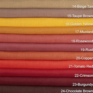 May include: A color palette of folded fabric swatches, showcasing a range of warm tones. Colors include beige tan, taupe brown, golden yellow, mustard, rosewood, rust, copper, tomato red, crimson, burgundy, and chocolate brown.