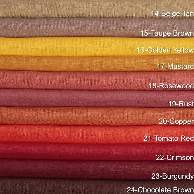 May include: A color palette of folded fabric swatches, showcasing a range of warm tones. Colors include beige tan, taupe brown, golden yellow, mustard, rosewood, rust, copper, tomato red, crimson, burgundy, and chocolate brown.