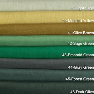 May include: A color palette of fabric swatches in shades of green, yellow, and gray. The swatches are labeled with color names and numbers, including "Light Sage," "Mustard Yellow," "Olive Brown," "Sage Green," "Emerald Green," "Gray Green," "Forest Green," and "Dark Olive."