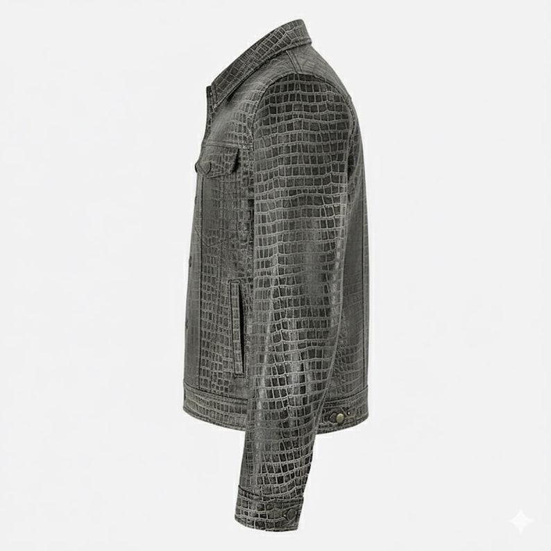 May include: A gray, textured jacket with a button-up front, two chest pockets, and two side pockets. The jacket has a crocodile skin pattern and a classic collar. The sleeves are long with buttoned cuffs. The jacket is made of a durable material.
