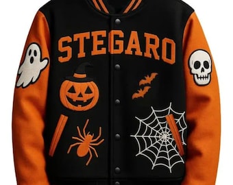 May include: Black and orange Halloween-themed letterman jacket with the word "STEGAR" in orange block letters. The jacket features a ghost, pumpkin, spider, bats, skull, and spiderweb patches. The sleeves are orange with black and orange striped cuffs.