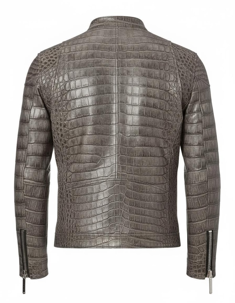 May include: A gray leather jacket with a crocodile skin texture. The jacket has a stand-up collar, long sleeves with zippered cuffs, and a tailored fit. The back view shows the intricate pattern and stitching details.