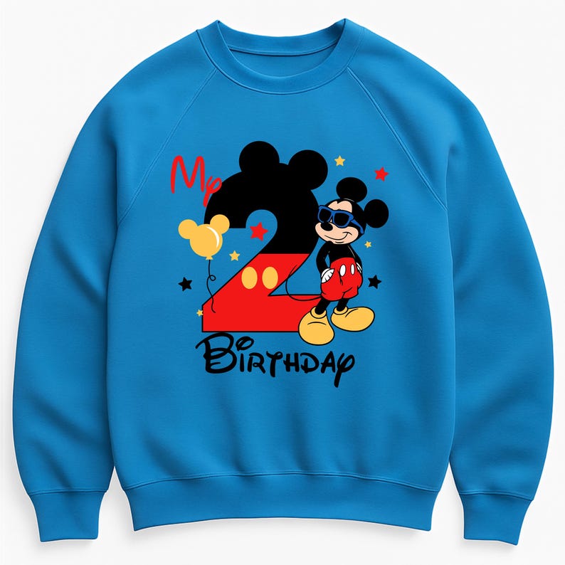 May include: A blue sweatshirt featuring a Mickey Mouse design for a second birthday. The design includes a large black number 2 with a red outline, Mickey Mouse wearing sunglasses, and the words "My Birthday". Yellow stars and a balloon complete the design.