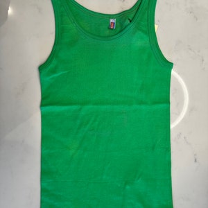 May include: A bright green sleeveless tank top.