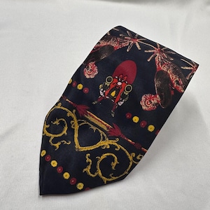 Corbata vintage de Warner Bros. de los años 80, con estampado de personajes en rojo y azul marino.
