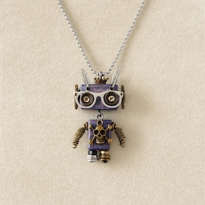 May include: A whimsical robot pendant necklace. The purple robot has silver-rimmed glasses, feather accents, and brass-colored arms. The robot's chest features a skull and crossbones. The necklace is made of a silver-colored chain.