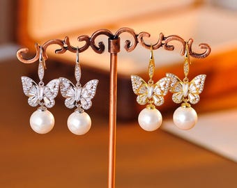 Orecchini pendenti con perle a forma di farfalla di cristallo: eleganti gioielli da sposa
