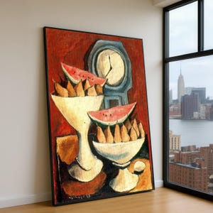 May include: A framed oil painting featuring two white pedestal bowls filled with brown pears and topped with slices of red watermelon. Behind the bowls sits a blue clock against a textured red background. The artwork is signed and dated 1928.