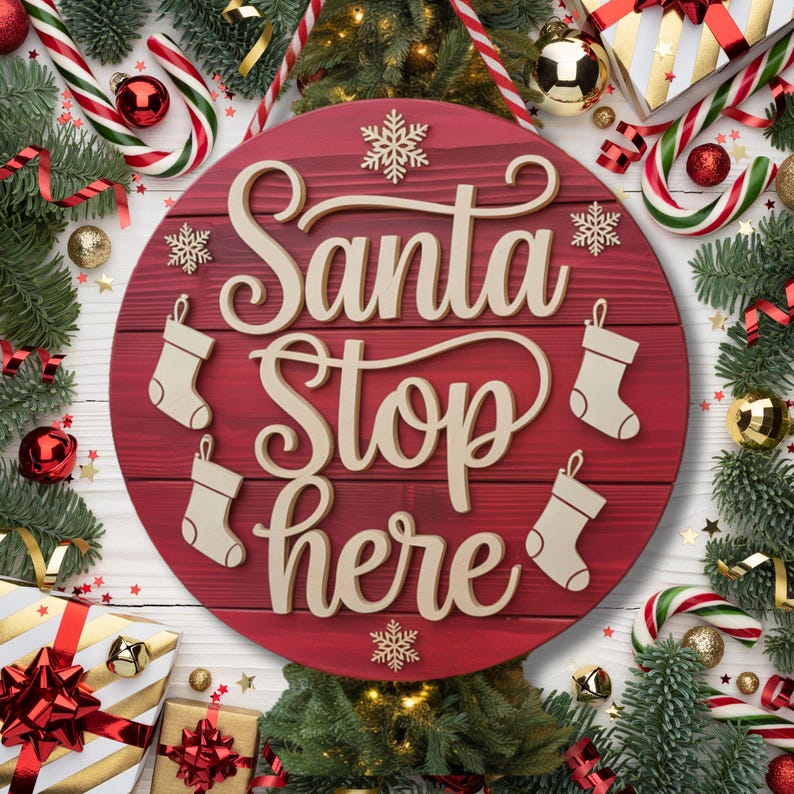 May include: A round, red wooden sign with the words "Santa Stop Here" in a cursive font. The sign is decorated with snowflakes and stocking shapes. The sign is surrounded by Christmas decorations, including candy canes, ornaments, and wrapped gifts.